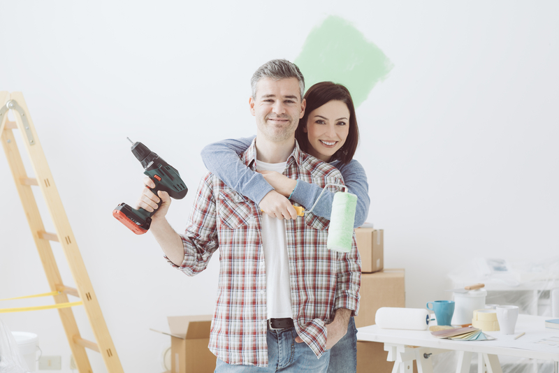 image of a husband and wife renovating the house