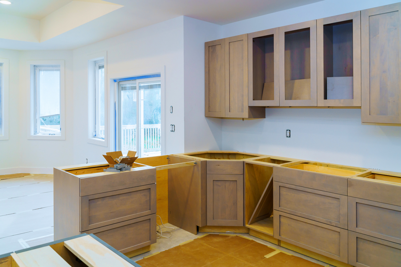 image of cupboards and cabinets in a kitchen that is under renovation