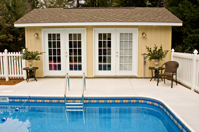 image of a backyard pool with fences